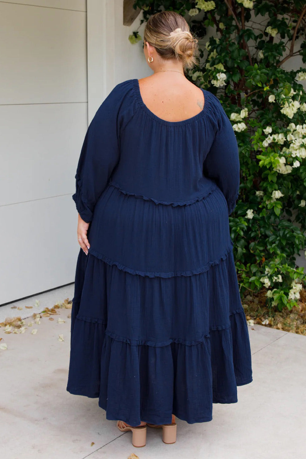 A model wearing the Lottie Midi Cotton Dress in colour Deepsea (Blue), from the back