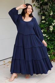 A model wearing the Lottie Midi Cotton Dress in colour Deepsea (Blue), from the front, showing the whole outfit