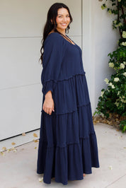 A model wearing the Lottie Midi Cotton Dress in colour Deepsea (Blue), from the front, showing the whole outfit