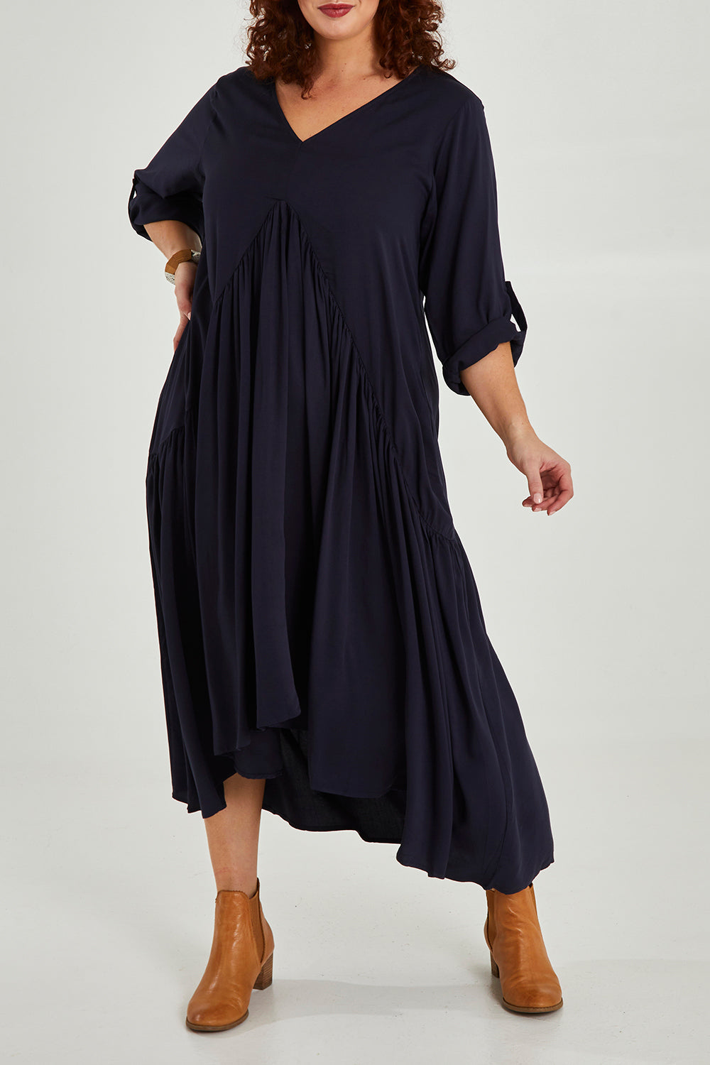 Model Maddy wearing the Long Sleeve Peak Maxi Dress in colour Navy (Blue), from the front, cropped image