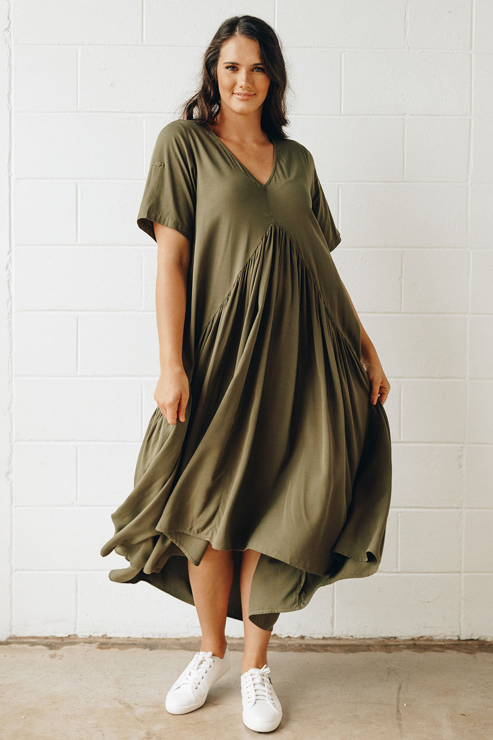 A model wearing the Short Sleeve Peak Maxi Dress in colour Khaki (Green), from the front, showing the whole outfit