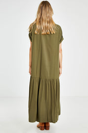 Model Kelly wearing the Short Sleeve Peak Maxi Dress in colour Khaki (Green), from the back