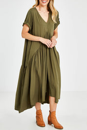 Model Kelly wearing the Short Sleeve Peak Maxi Dress in colour Khaki (Green), from the front, cropped image