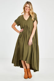 Model Kelly wearing the Short Sleeve Peak Maxi Dress in colour Khaki (Green), from the front, showing the whole outfit