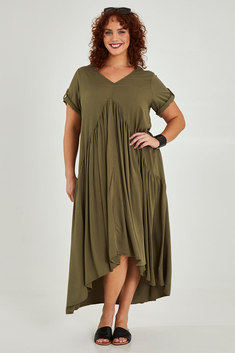 Model Maddy wearing the Short Sleeve Peak Maxi Dress in colour Khaki (Green), from the front, showing the whole outfit
