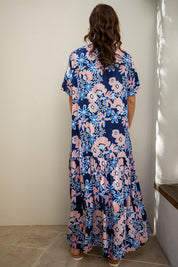 A model wearing the S/S Peak Maxi Dress in colour Harvest (Blue), from the back
