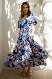A model wearing the S/S Peak Maxi Dress in colour Harvest (Blue), from the front, showing the whole outfit