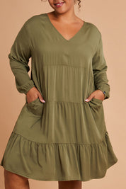 Model Alexis wearing the Long Sleeve Chic Dress in colour Khaki (Green), from the front, cropped image