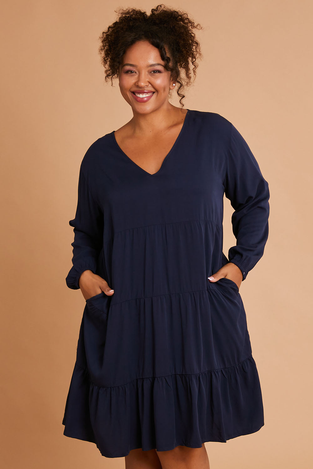 Model Alexis wearing the Long Sleeve Chic Dress in colour Navy (Blue), from the front, cropped image