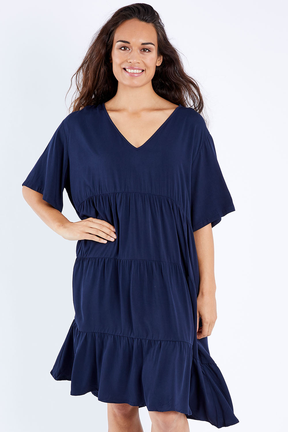 Model Larissa wearing the Chic Dress in colour Navy (Blue), from the front, cropped image