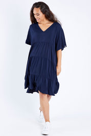 Model Larissa wearing the Chic Dress in colour Navy (Blue), from the front, showing the whole outfit