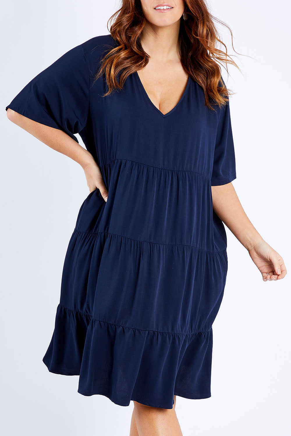 Model Laura wearing the Chic Dress in colour Navy (Blue), from the front, cropped image