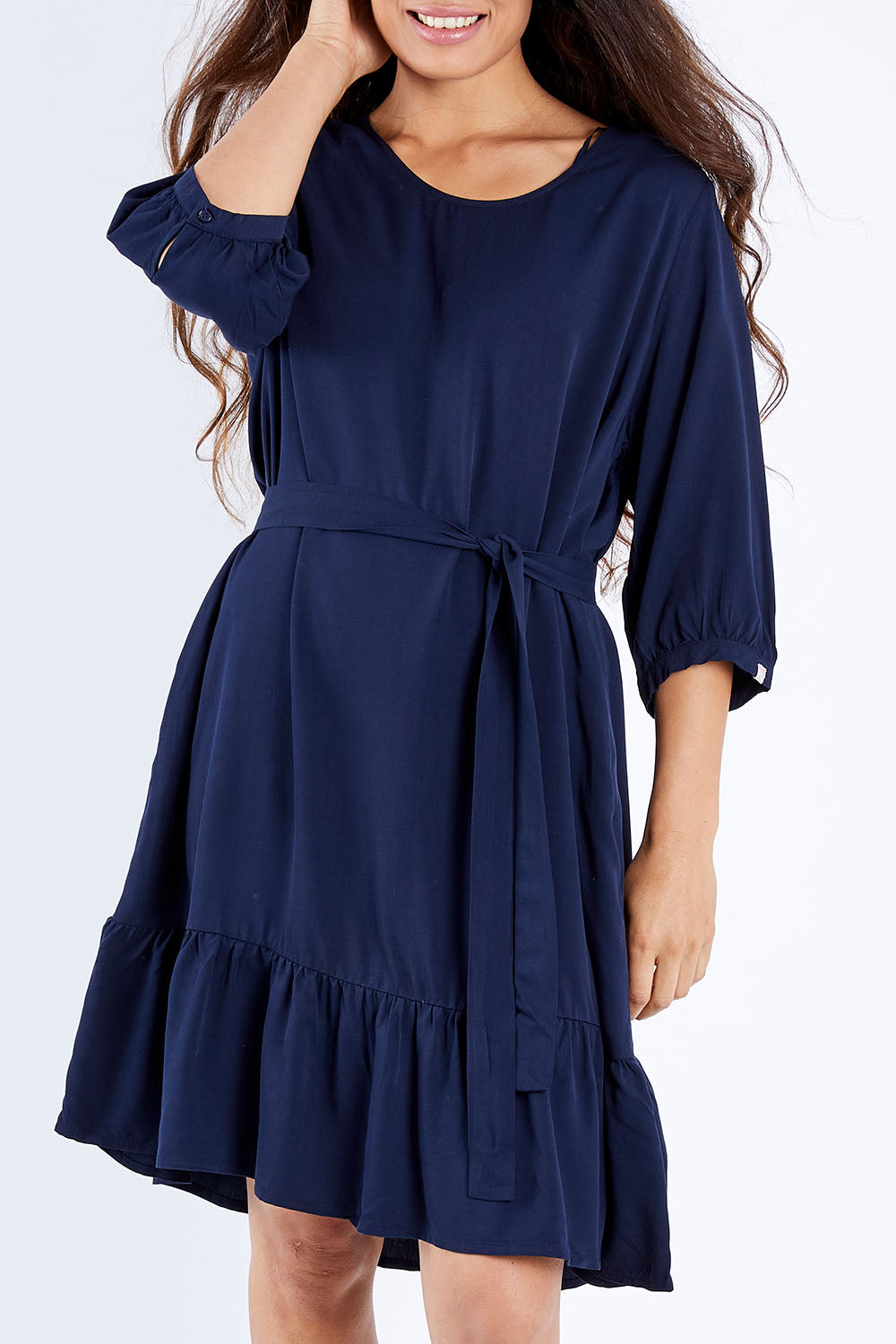 Model Larissa wearing the Flare Dress in colour Navy (Blue), from the front, cropped image