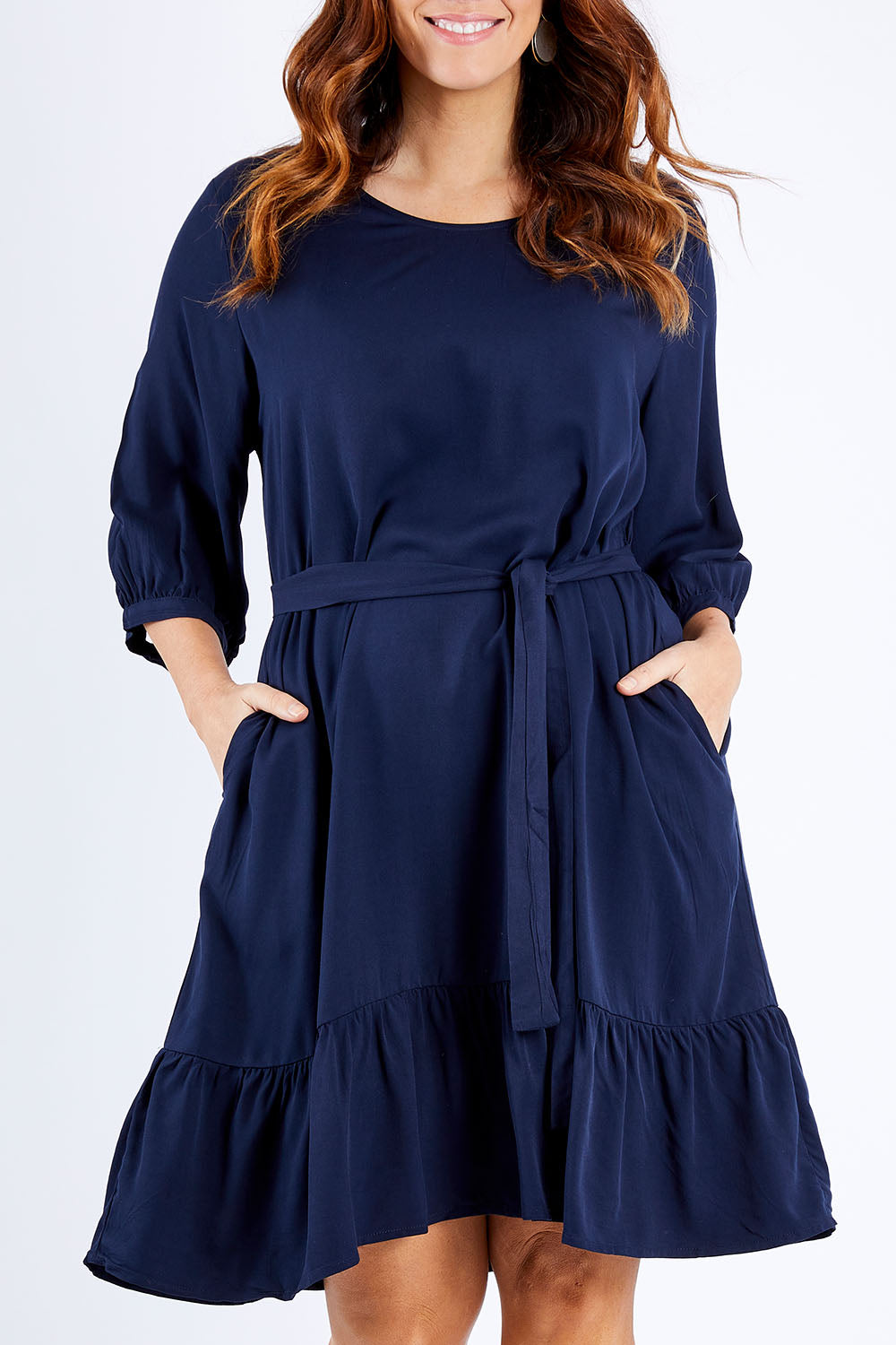 Model Laura wearing the Flare Dress in colour Navy (Blue), from the front, cropped image