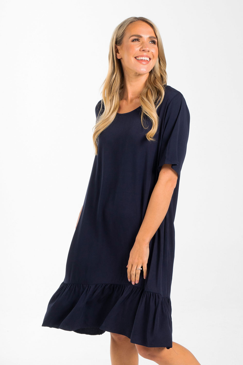 A model wearing the Short Sleeve Flare Dress in colour Navy (Blue), from the front, cropped image