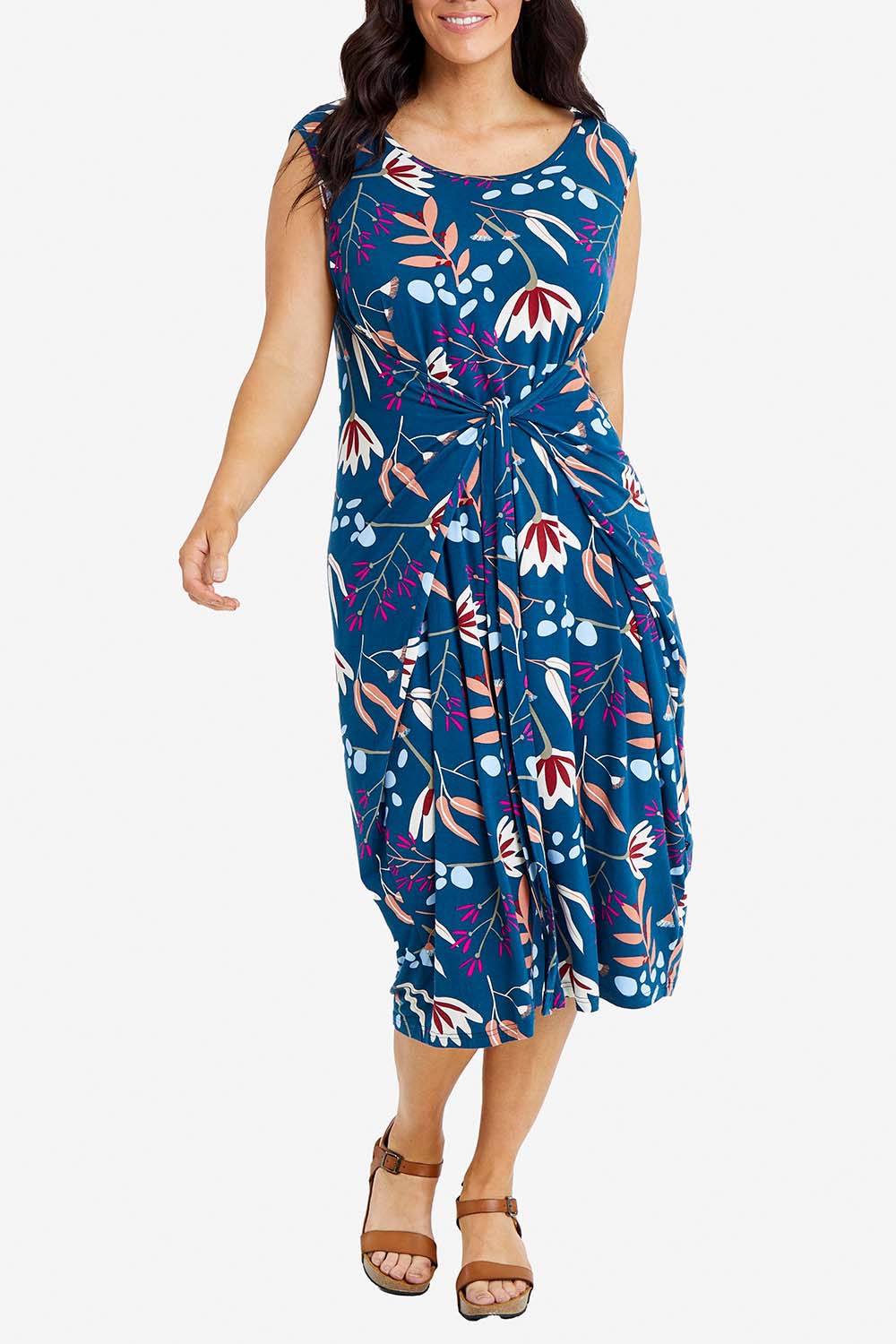 Model Laura wearing the Sleeveless Tidal Multi Wear Dress in colour Nightbloom (Blue), from the front, cropped image