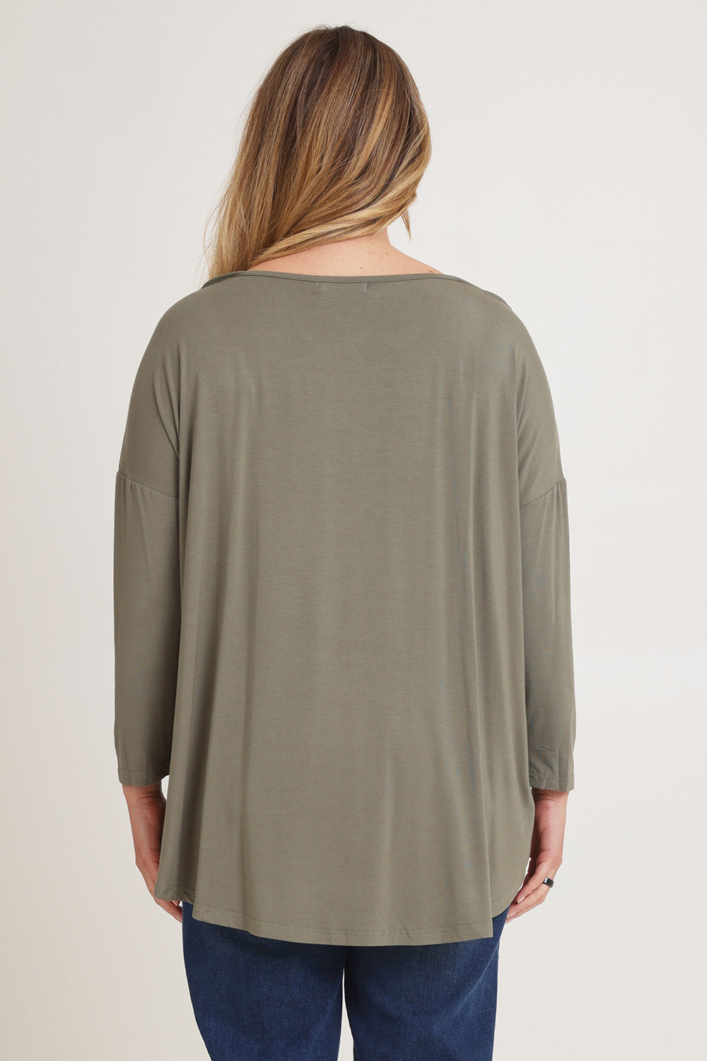 Model Chanel wearing the Pippa Bamboo Top in colour Fern (Green), from the back
