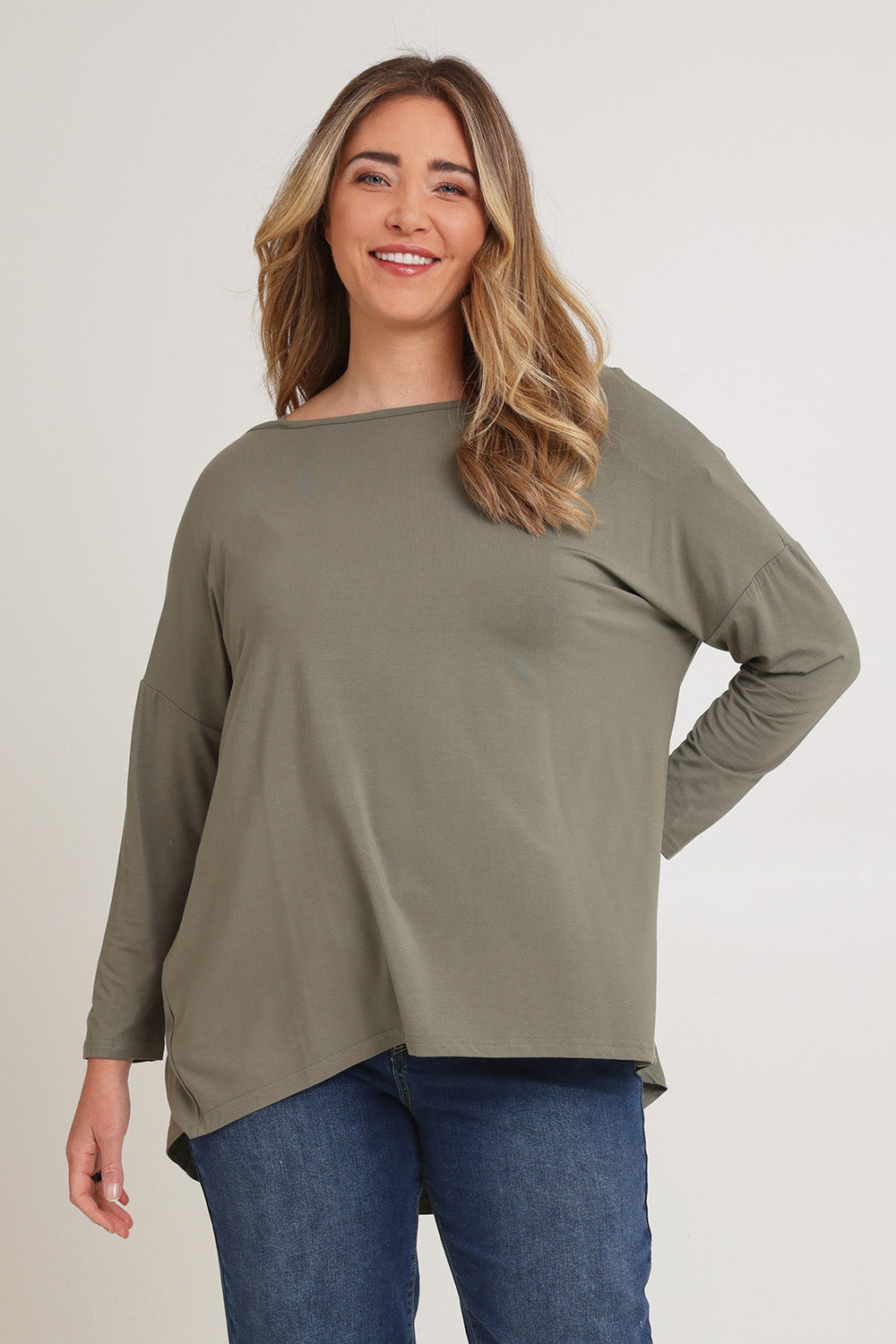 Model Chanel wearing the Pippa Bamboo Top in colour Fern (Green), from the front, cropped image