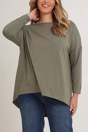 Model Chanel wearing the Pippa Bamboo Top in colour Fern (Green), from the front, cropped image