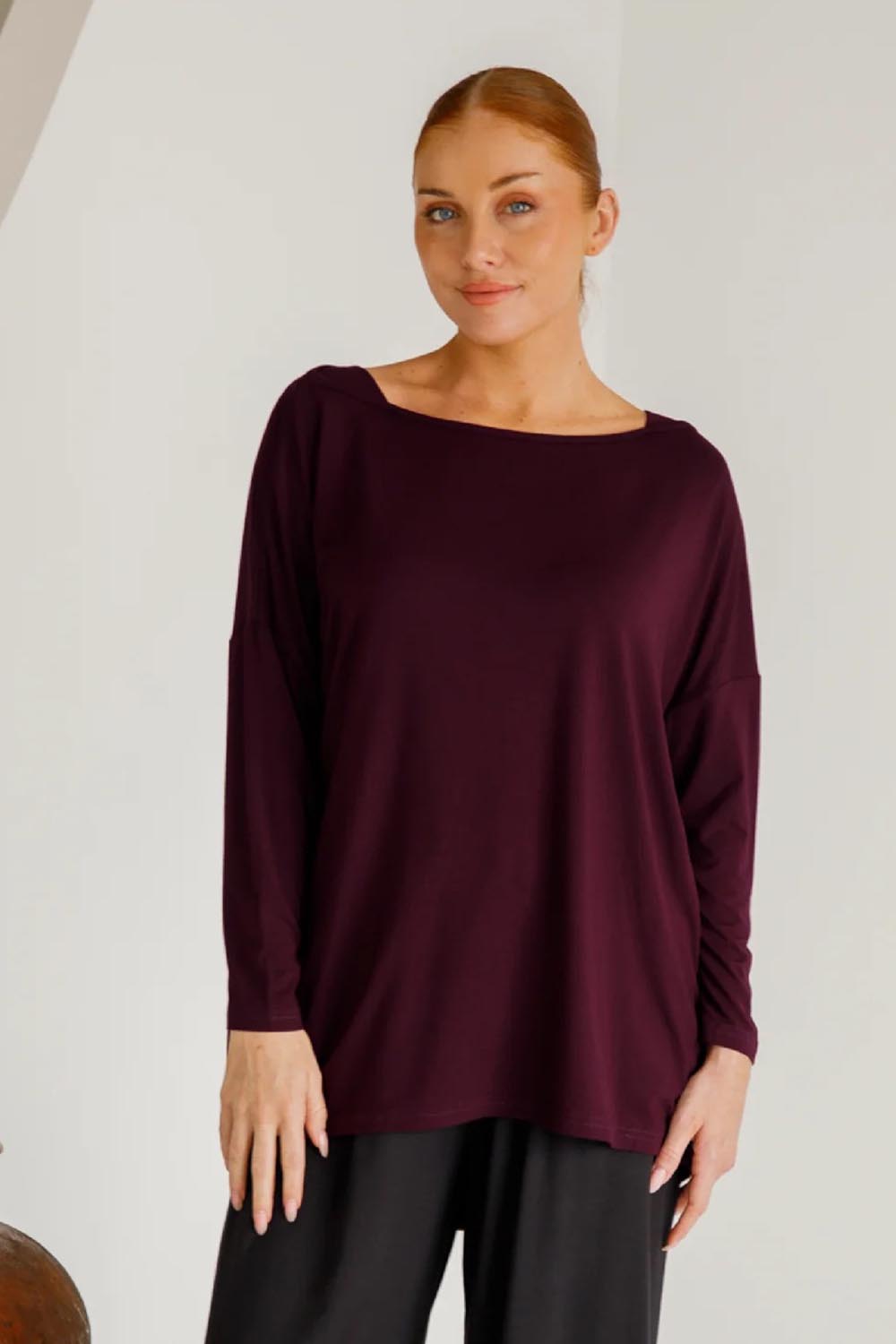 A model wearing the Pippa Bamboo Top in colour Shiraz (Purple), from the front, cropped image