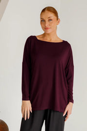 A model wearing the Pippa Bamboo Top in colour Shiraz (Purple), from the front, cropped image