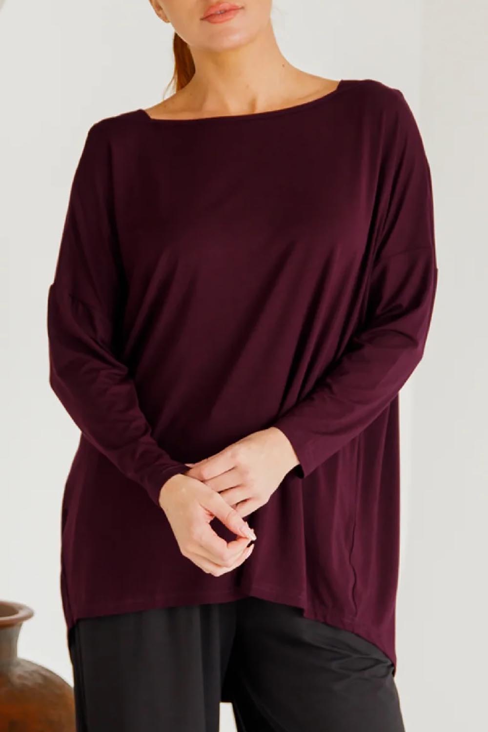A model wearing the Pippa Bamboo Top in colour Shiraz (Purple), from the front, cropped image