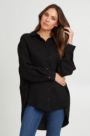 Model Madeline wearing the Amore Tencel Shirt in colour Black (Black), from the front, cropped image
