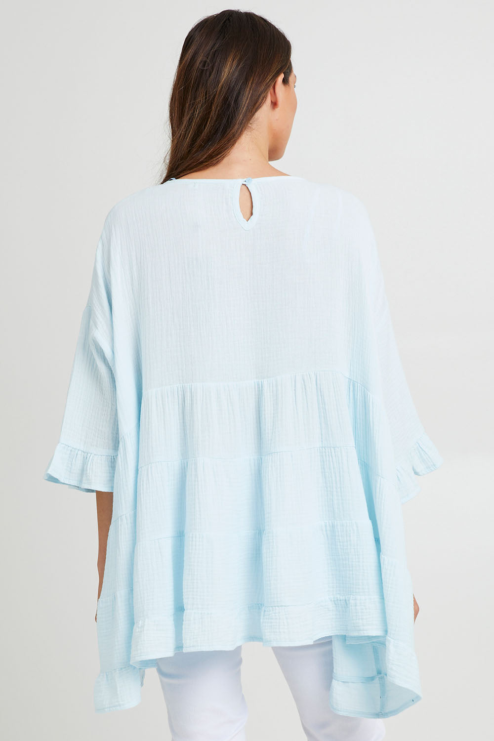 Model Madeline wearing the Sofia Top in colour Blue (Blue), from the back
