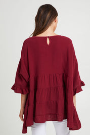 Model Madeline wearing the Sofia Top in colour Mahogany (Pink), from the back