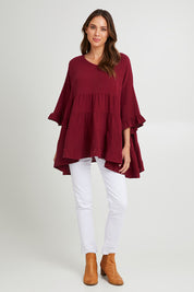 Model Madeline wearing the Sofia Top in colour Mahogany (Pink), from the front, showing the whole outfit