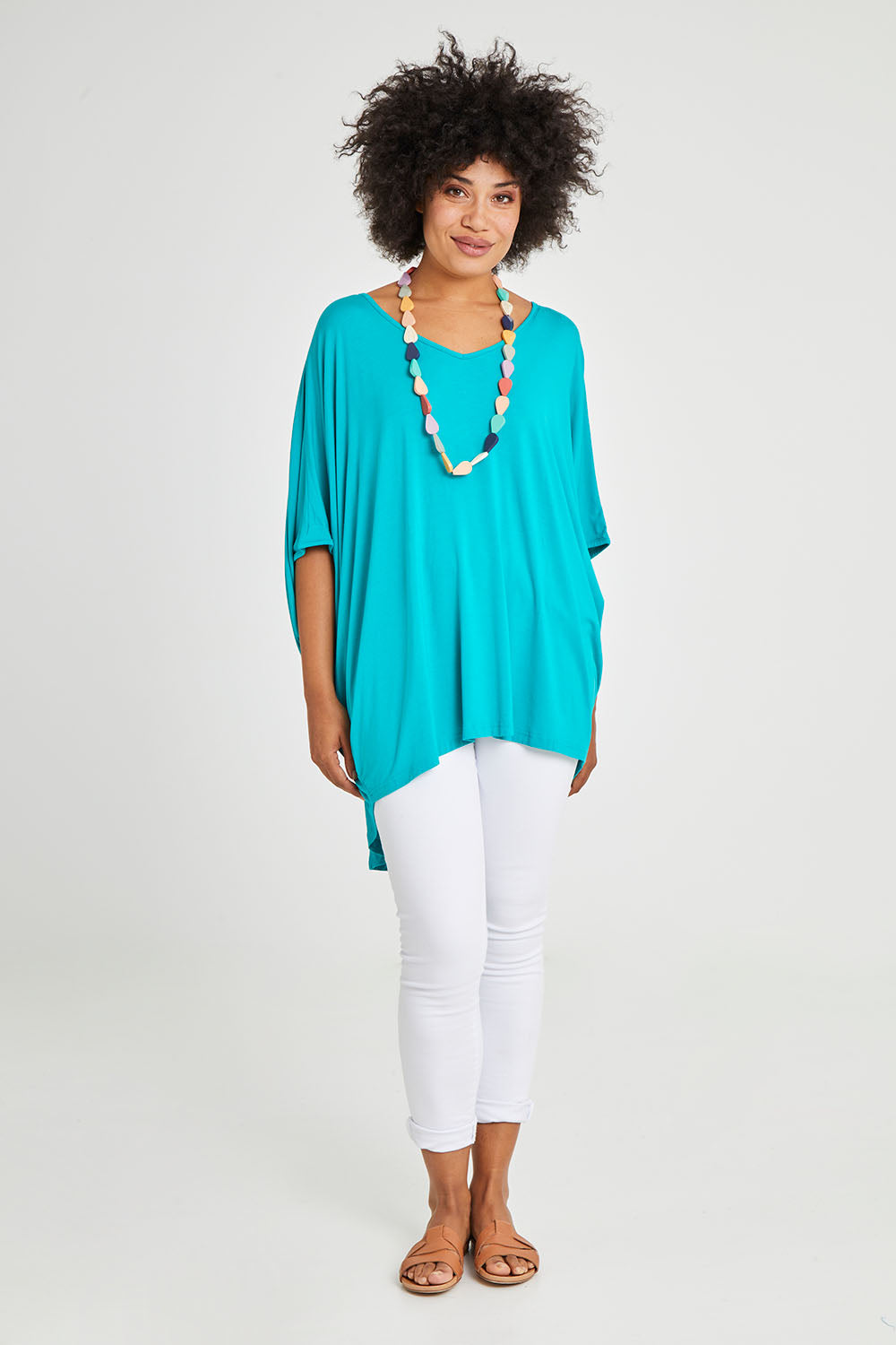Model Olivia wearing size OneSize of the Hi Low Miracle Bamboo Top in colour Jade (Green), from the front, showing the whole outfit