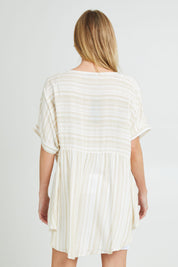 Model Grace wearing the Beachy Top in colour Beige, from the back