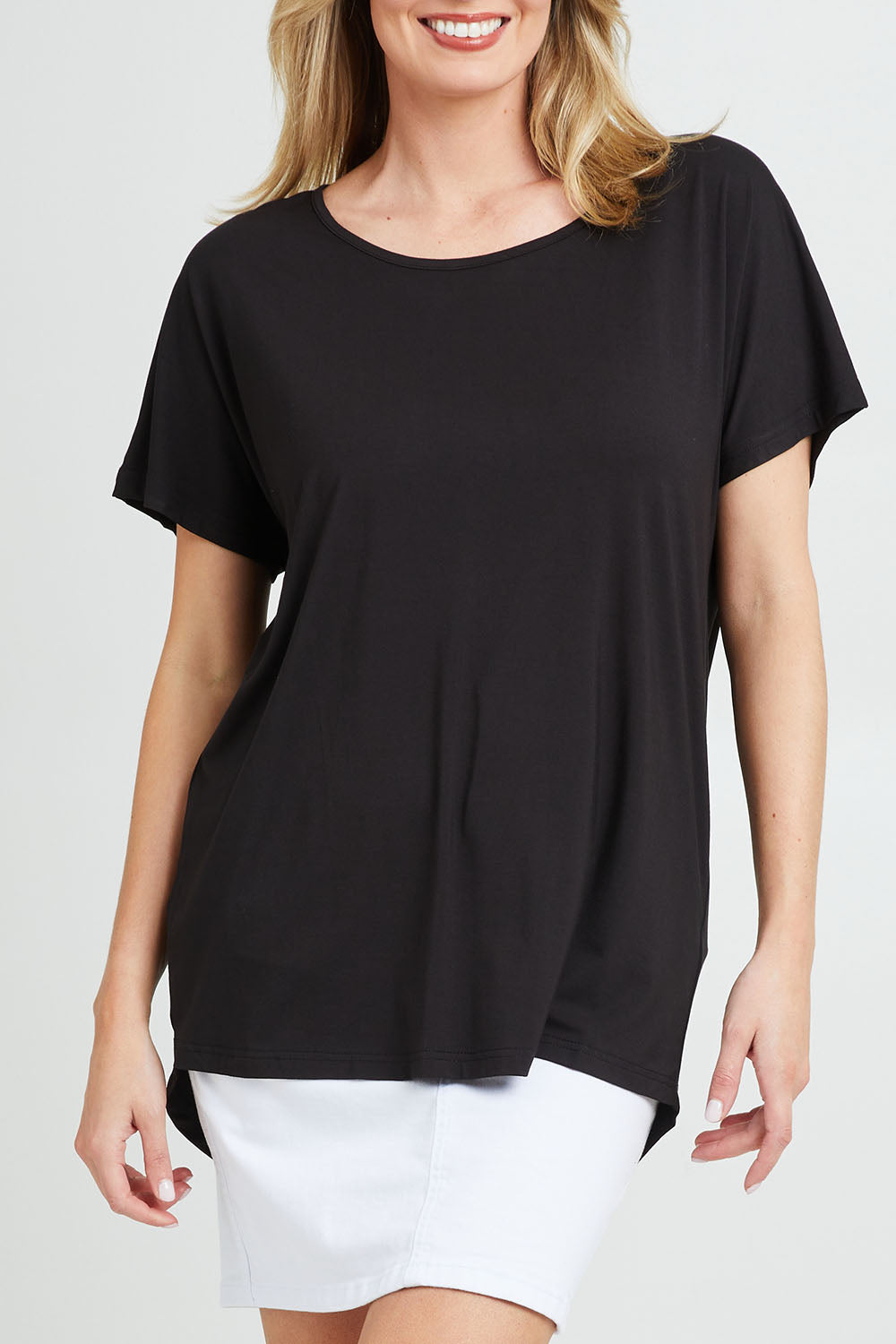 Model Grace wearing the Destiny Top in colour Black (Black), from the front, cropped image