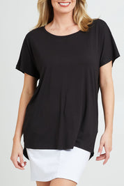 Model Grace wearing the Destiny Top in colour Black (Black), from the front, cropped image
