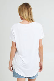 Model Grace wearing the Destiny Top in colour White (White), from the back