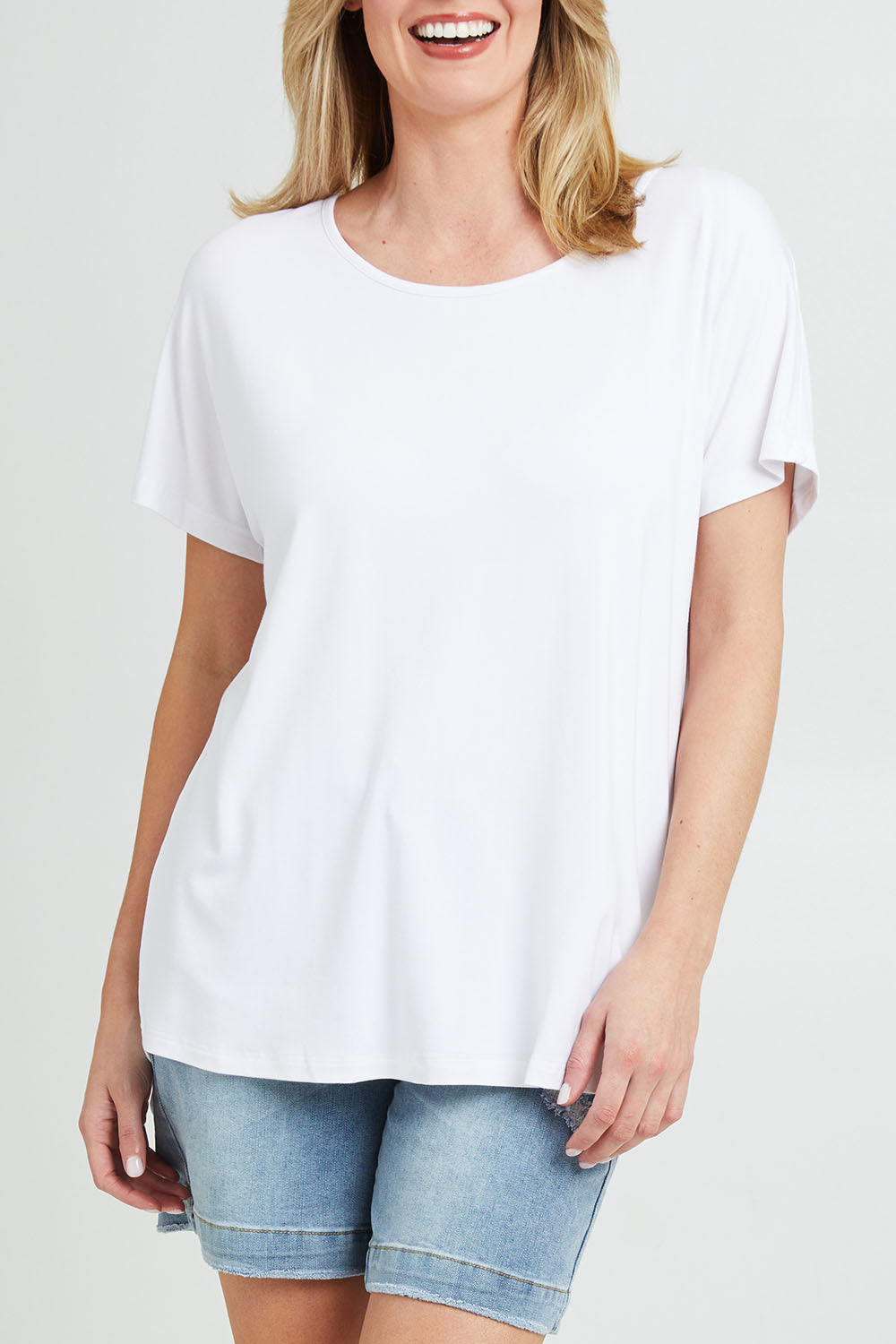 Model Grace wearing the Destiny Top in colour White (White), from the front, cropped image