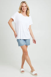 Model Grace wearing the Destiny Top in colour White (White), from the front, showing the whole outfit