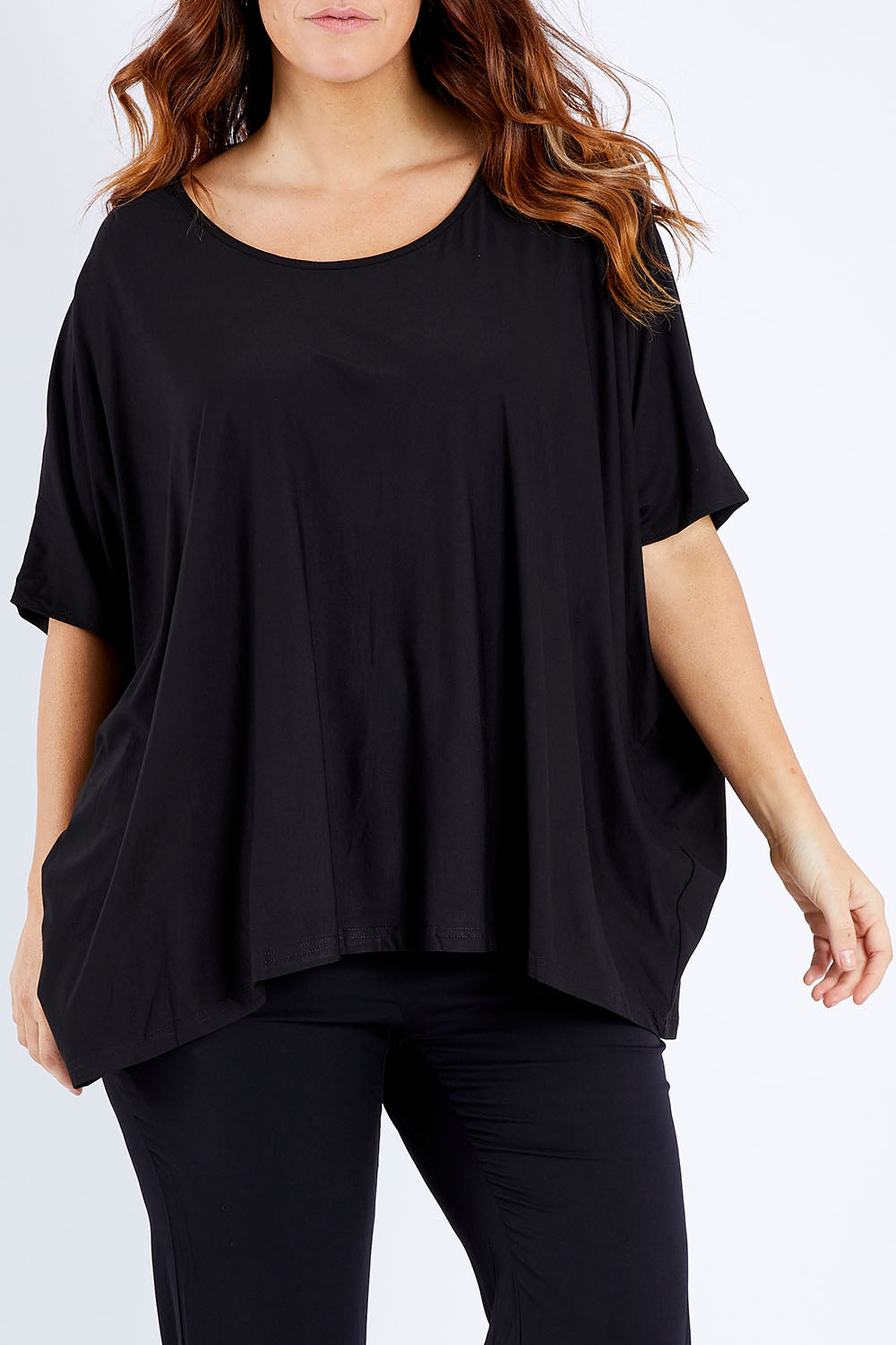Model Laura wearing size OneSize of the Nice Top in colour Black (Black), from the front, cropped image