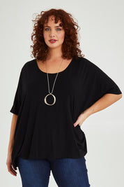 Model Maddy wearing size OneSize of the Nice Top in colour Black (Black), from the front, cropped image