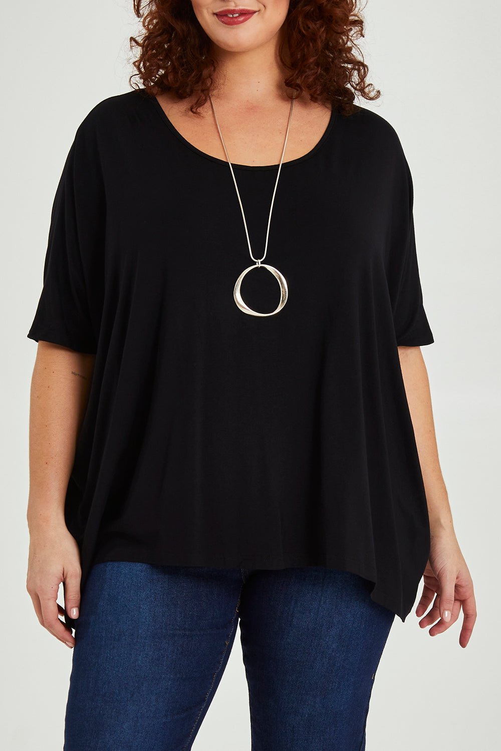 Model Maddy wearing size OneSize of the Nice Top in colour Black (Black), from the front, cropped image