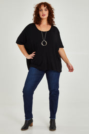 Model Maddy wearing size OneSize of the Nice Top in colour Black (Black), from the front, showing the whole outfit