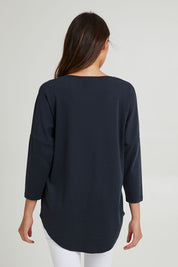 Model Madeline wearing the L/S Destiny Lounge Top in colour Spaceblue (Blue), from the back