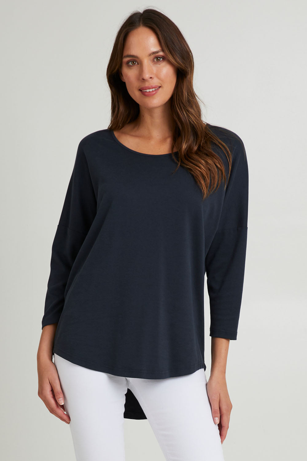 Model Madeline wearing the L/S Destiny Lounge Top in colour Spaceblue (Blue), from the front, cropped image