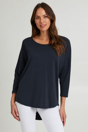 Model Madeline wearing the L/S Destiny Lounge Top in colour Spaceblue (Blue), from the front, cropped image