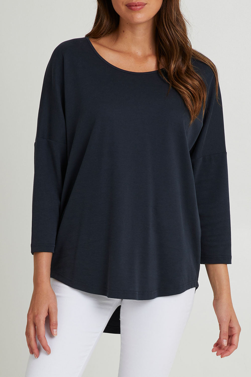Model Madeline wearing the L/S Destiny Lounge Top in colour Spaceblue (Blue), from the front, cropped image