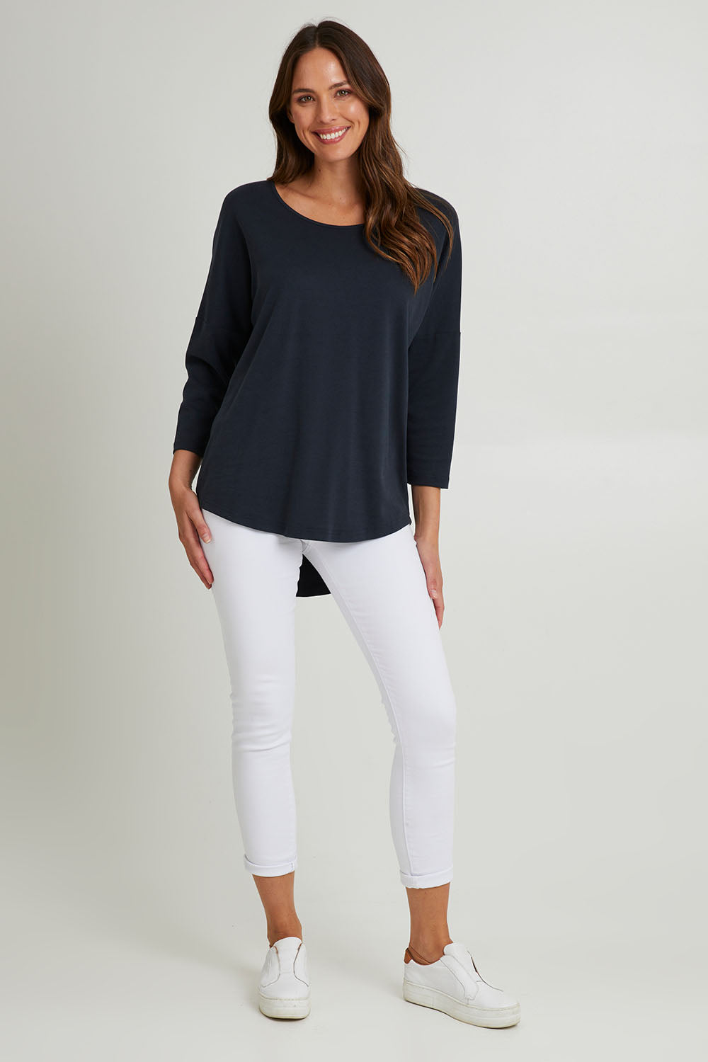 Model Madeline wearing the L/S Destiny Lounge Top in colour Spaceblue (Blue), from the front, showing the whole outfit