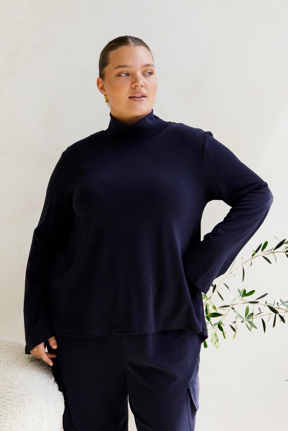 A model wearing the Jazmine Cotton Blend Top in colour Midnight (Blue), from the front, cropped image