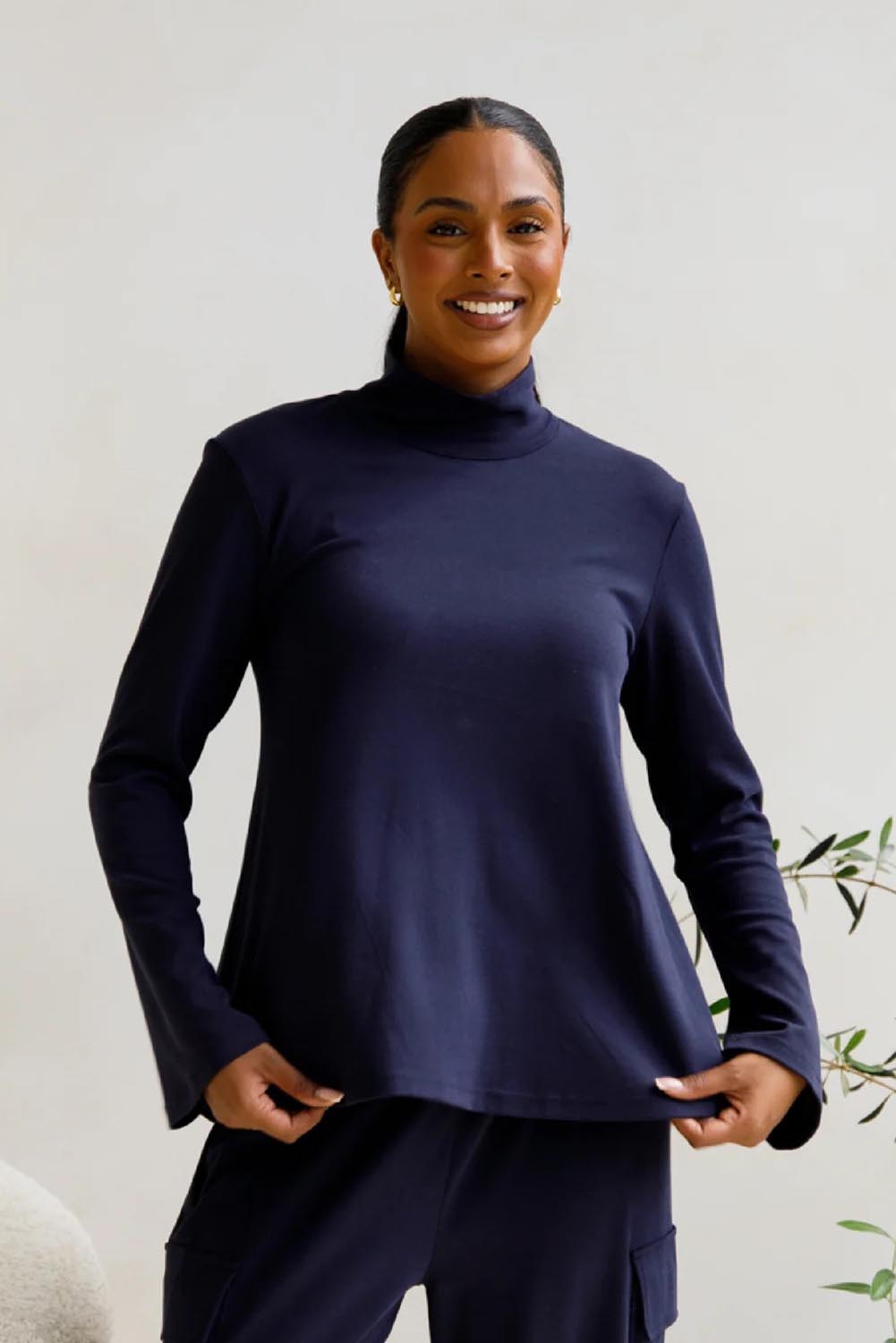 A model wearing the Jazmine Cotton Blend Top in colour Midnight (Blue), from the front, cropped image