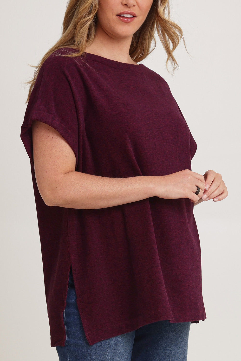 Model Chanel wearing size XL of the Bridget Top in colour Berry (Purple), from the front, cropped image