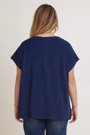 Model Chanel wearing size XL of the Bridget Top in colour Ocean (Blue), from the back